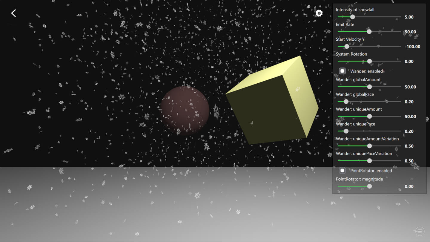 Two colored cubes with falling snow particles and particle settings panel
