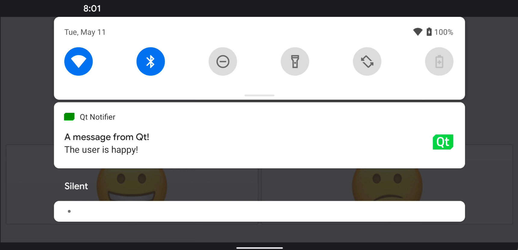 Android notification panel showing Qt Notifier message with happy and sad smiley buttons